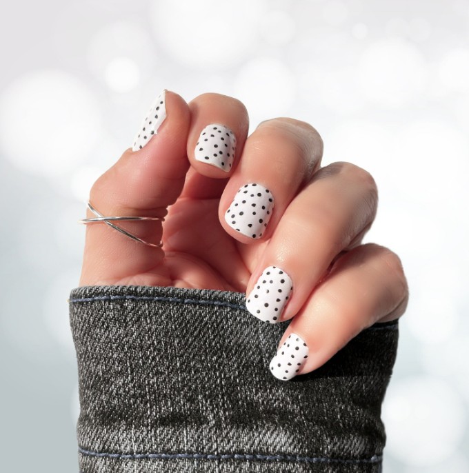 Professional black-dotted white nails