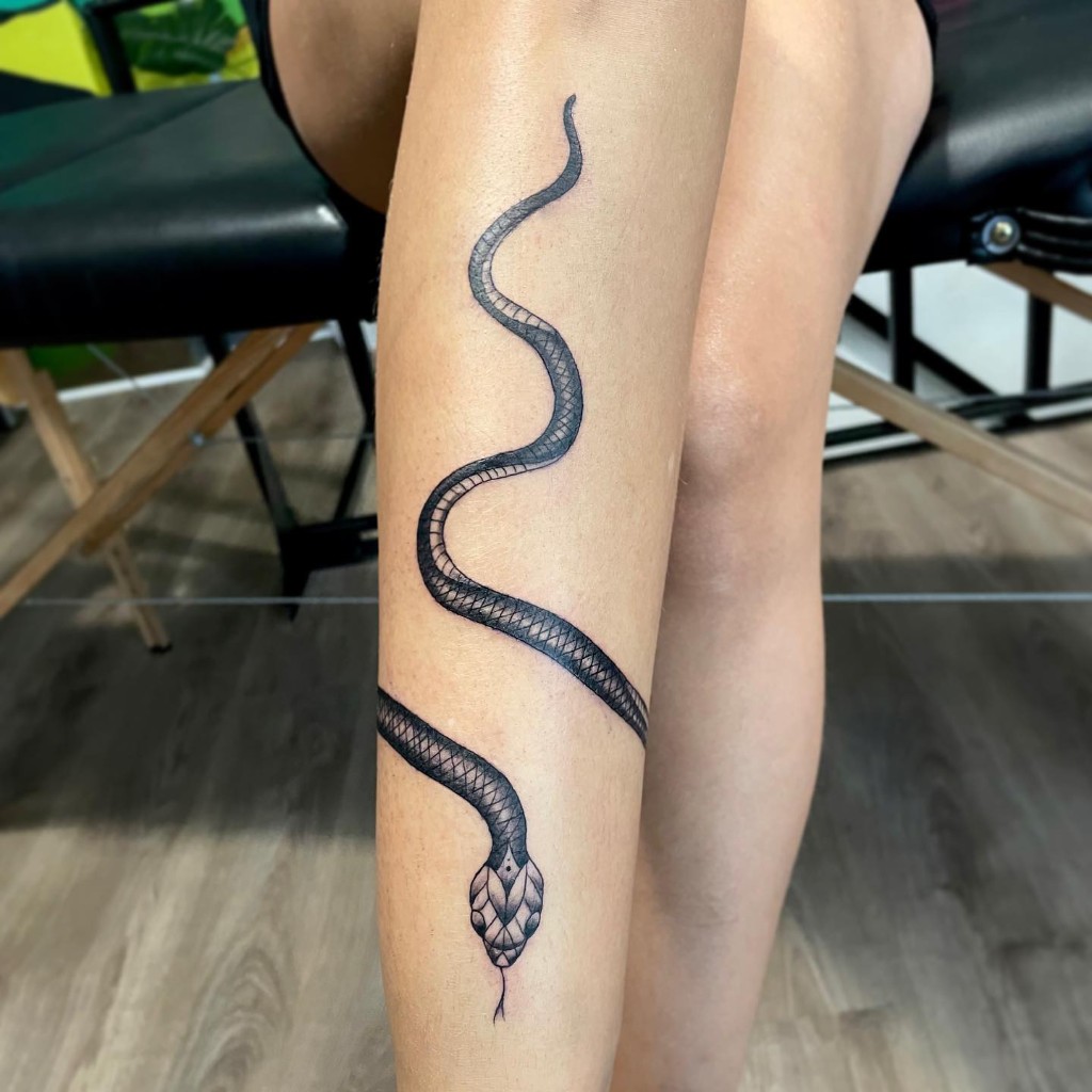 LEG TATTOO SNAKE ENTWINED BY SERPENTINE STYLE